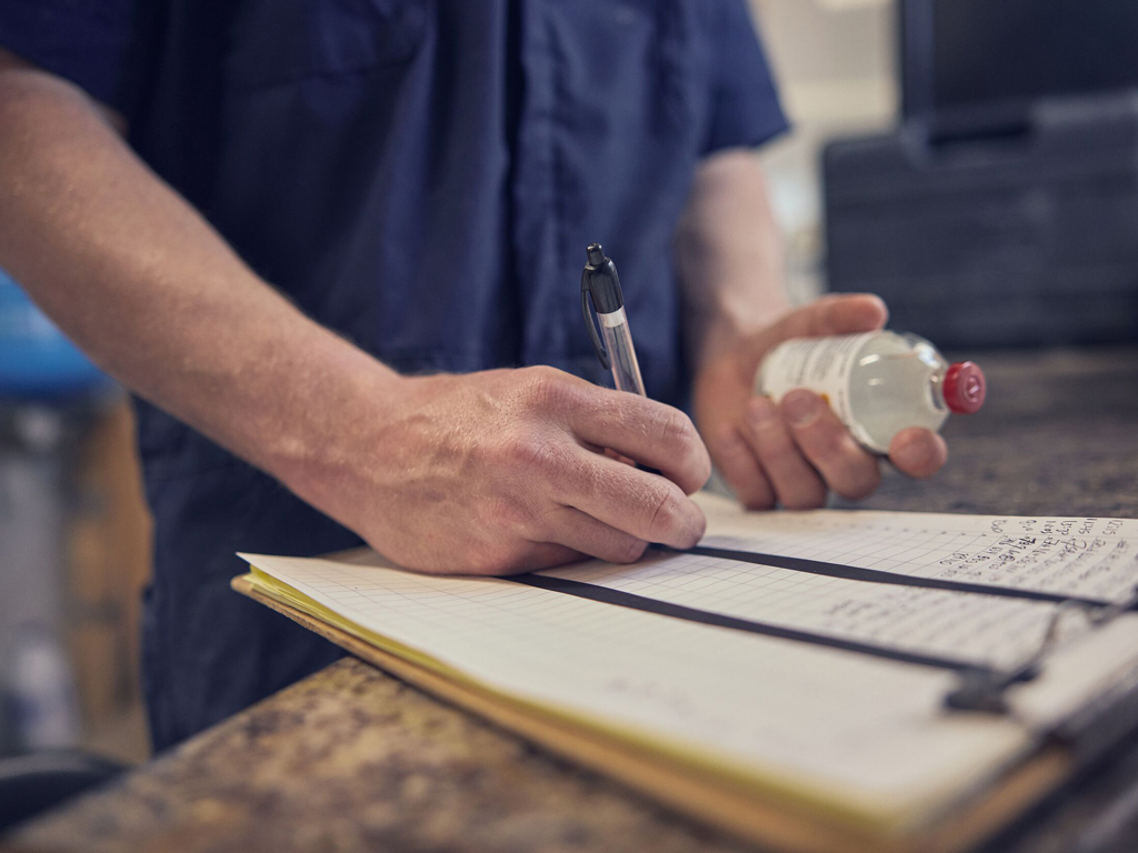 Vet taking notes about antibiotics