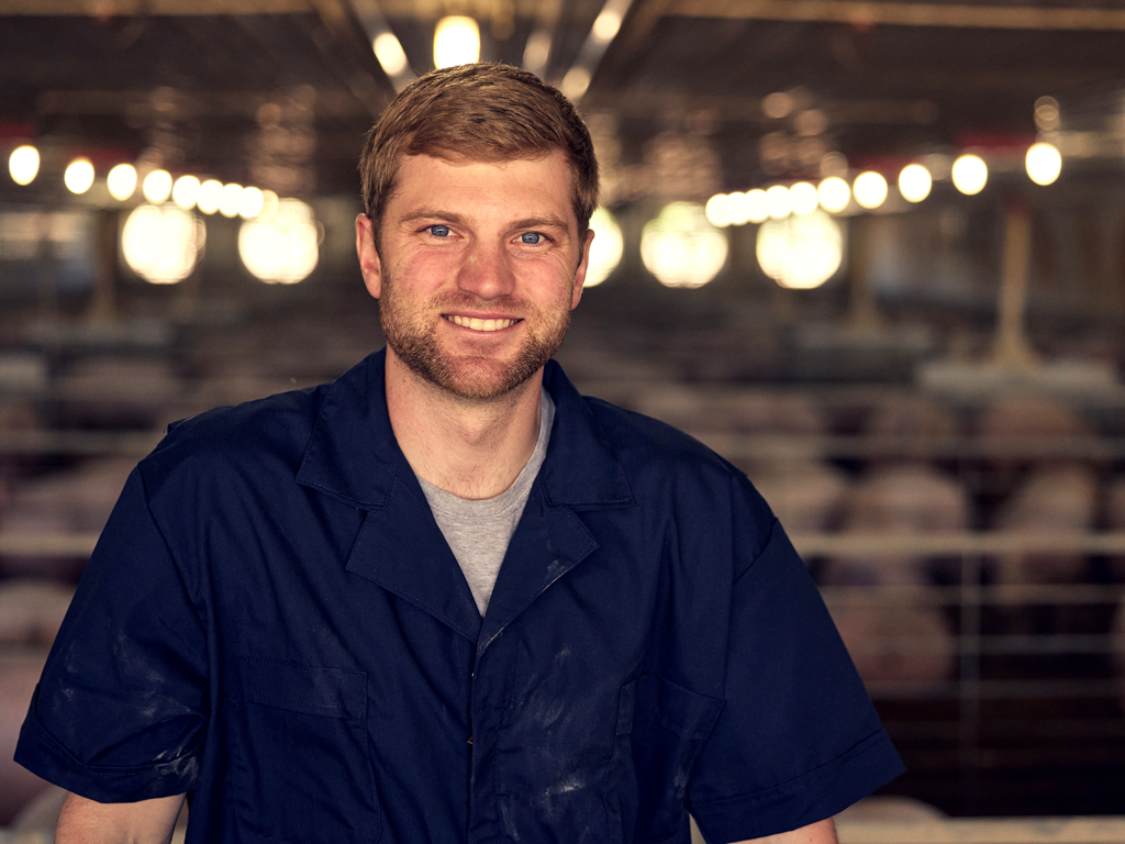 Producer in the barn at an Iowa farm